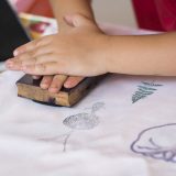 Photo of a child using a stamp