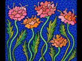 Pink and orange polka-dotted flowers set on a blue, tiled background.