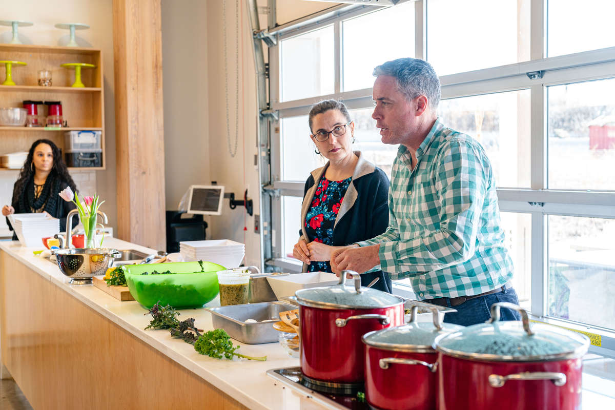 Photo of Lisa Whitmer and Aaron Bertelsen in the Edible Academy