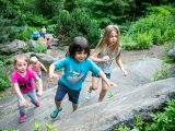 Children playing and climbing rocks