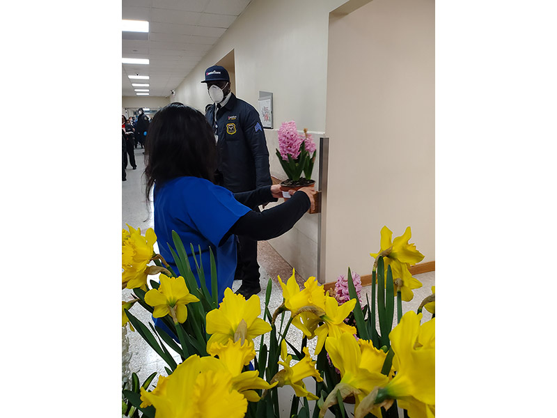 Photo of medical staff receiving flowers