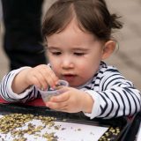 Child playing with seeds