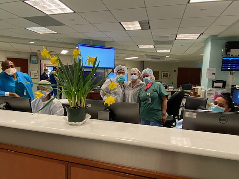 Photo of medical staff receiving flowers