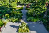 aerial view of a garden with gray pavement creating a square in the center