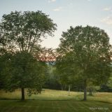 An image of acres of fields and woods and a view of the Berkshire foothills