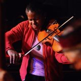 Photo of Judith Insell playing viola