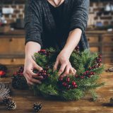 Student creating a wreath