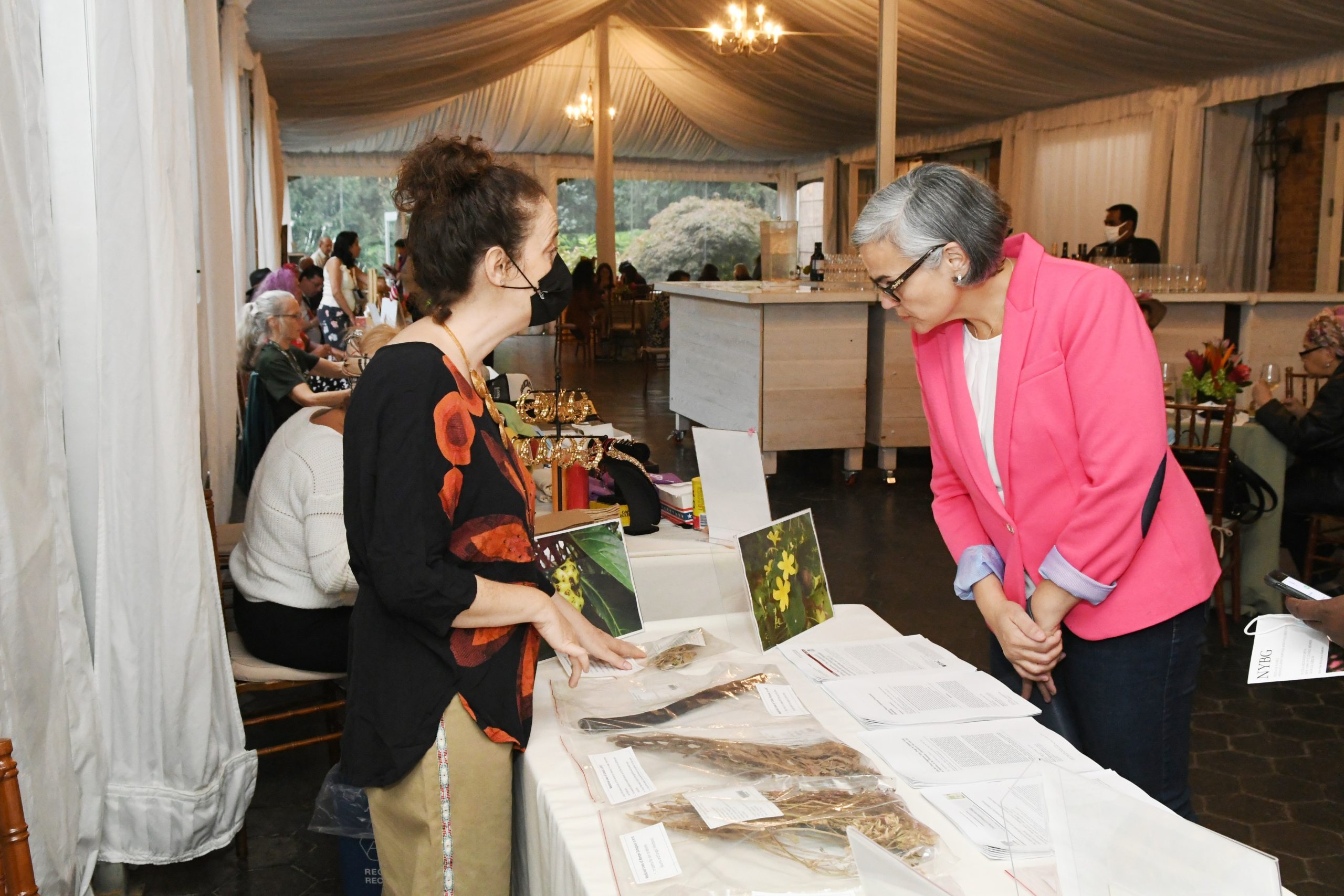 Visitors view an artist's table