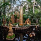 A display of the Statue of Liberty, One World Trade, and other downtown buildings made of plant materials