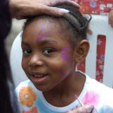 A child getting their face painted