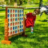 A child looking at Connect Four game