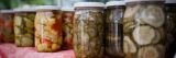 close up shot of pickles in jars
