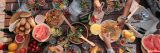 High angle view of group of people sitting at the table and have dinner they celebrating the holiday outdoors