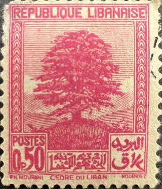 A stamp depicting a tree on a hill in pink ink; it says "Republique Libanaise"