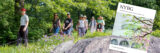Catalog cover placed over an image of a class outside