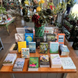 a table display featuring several books that focus on Earth Month
