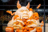 A monstrous orange pumpkin sculpture