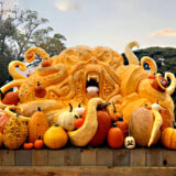 An enormous pumpkin sculpture depicting a tentacled monster