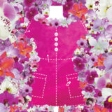 A pink design for a dress surrounded by hundreds of pink, red, purple, and white orchids