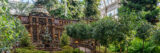 a model building of the LuEsther T. Mertz Library surrounded by miniature trees and foliage