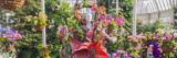 An elaborate flower show featuring white mannequins in botanical dresses