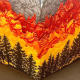 A book cover depicting a forest fire in gray, black, red, and orange