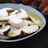 A plate of sliced brown and white mushrooms