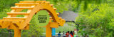 A yellow gateway reading "Everett Children's Adventure Garden"