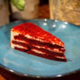 A slice of red and white cake