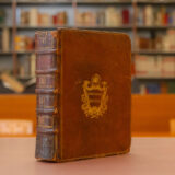A brown-wrapped leather book with golden imprint on the cover