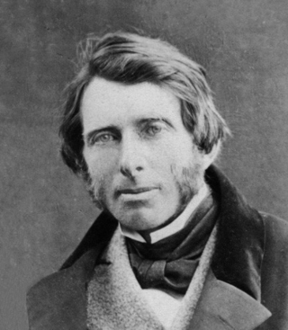 A black and white photo of a person wearing an ascot and coat
