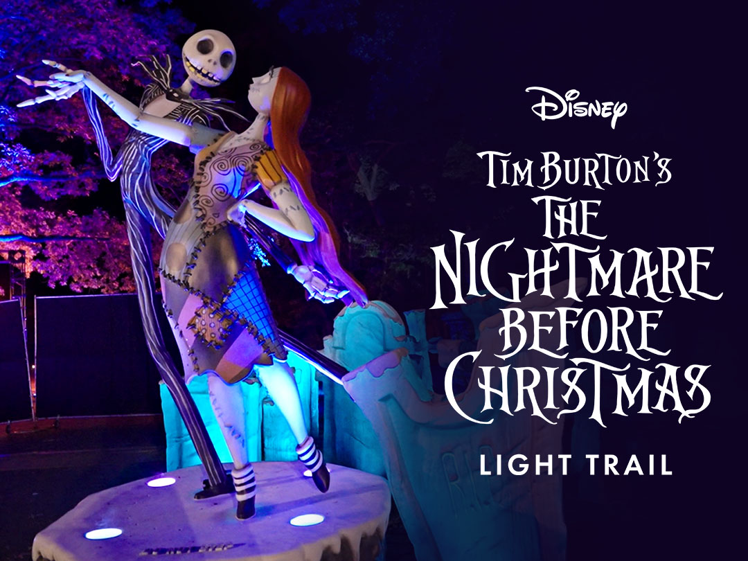 Two characters dance in the moonlight next to the words "Disney Tim Burton's The Nightmare Before Christmas Light Trail"
