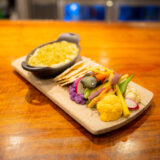A plated dish of colorful vegetables