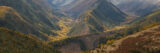 A mountain range of trees in autumn hues