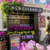 Visitor enjoying the Newsstand installation at The Orchid Show: Mr. Flower Fantastic's Concrete Jungle mco dsc02981 web