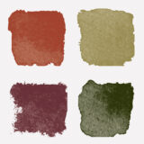 An arrangement of paint swatches in red, purple, green, and tan