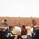 A band plays to an enormous crowd
