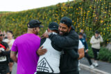 People embrace among a crowd