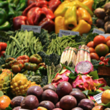 A colorful arrangement of fruits and vegetables in a market setting