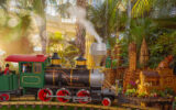 Model train in foreground with replicas of NYC landmark buildings in the background in NYBG's Enid A. Haupt Conservatory during the Holiday Train Show mco m10r9685 edit.jpg