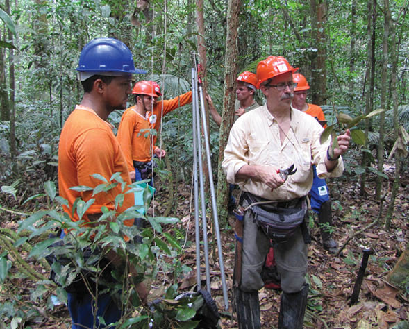 Dr  Doug Daly with mateiros wearing hard hats in Brazil 