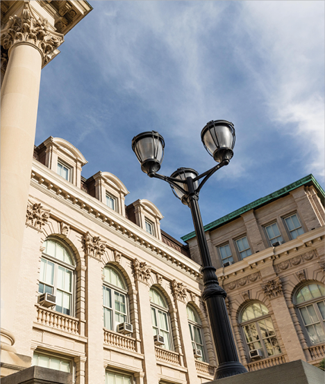 One World Trade Center replica in construction being held in an artist s hand