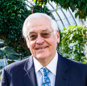 Headshot of J  Barclay Collins II, Chair of the NYBG Board, inside the Enid A  Haupt Conservatory